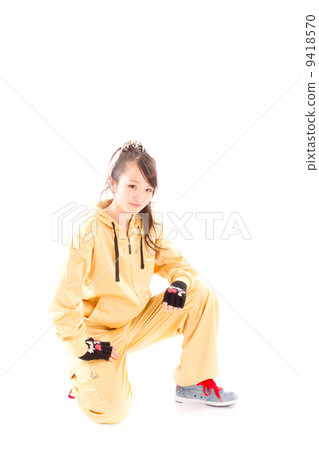 A pretty cheerful girl who dances hip-hop dance 9418570