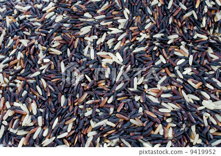 Black and White long rice background, uncooked raw cereals, macr 9419952