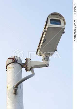 CCTV Security camera on blue sky background CCTV Security camera on blue sky background 9419978