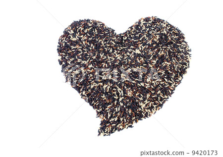 Mixed Pile of black Rice and white rice Shaped into a Heart 9420173