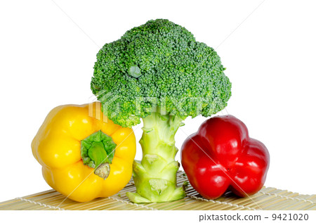 Colored paprika (pepper) and Broccoli on a white background Colored paprika (pepper) and Broccoli on a white background 9421020
