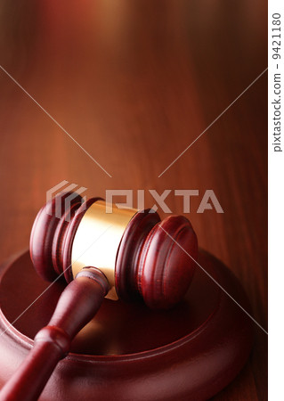 Gavel on a sounding block, symbol of authority 9421180