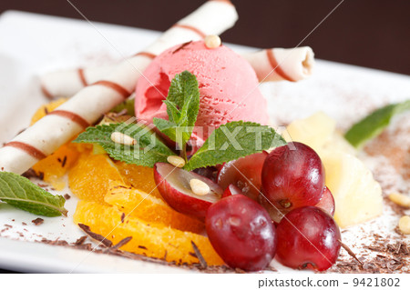 tasty dessert with ice cream and fruits tasty dessert with ice cream and fruits 9421802