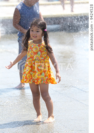 Girls playing in the fountain 9424528