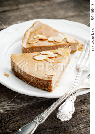 Pieces of Chocolate Cheesecake with Almond flakes Pieces of Chocolate Cheesecake with Almond flakes 9426060