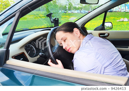 Young girl sleeps in her car. Young girl sleeps in her car. 9426413