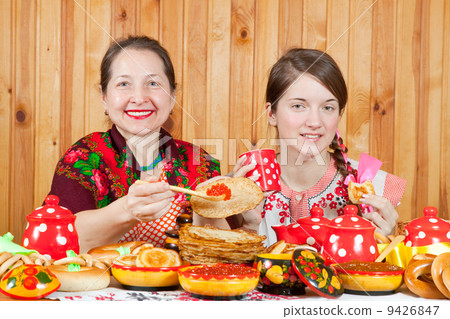 Women eating pancake Women eating pancake 9426847