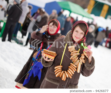 Women with pancake during Maslenitsa festival Women with pancake during Maslenitsa festival 9426877