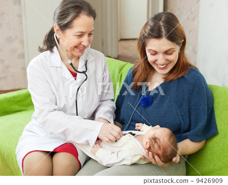 doctor examining newborn baby with phonendoscope 9426909