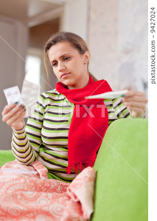 Sick woman at living room Sick woman at living room 9427024