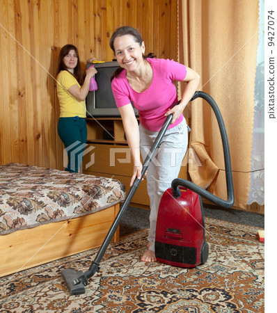 Women cleaning in home Women cleaning in home 9427074