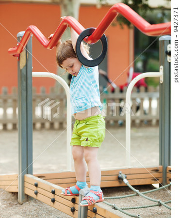 Three-year girl at playground Three-year girl at playground 9427371