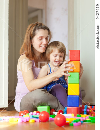 pregnant mother plays with child 9427419