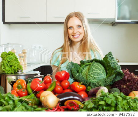 happy woman with raw vegetables 9427552