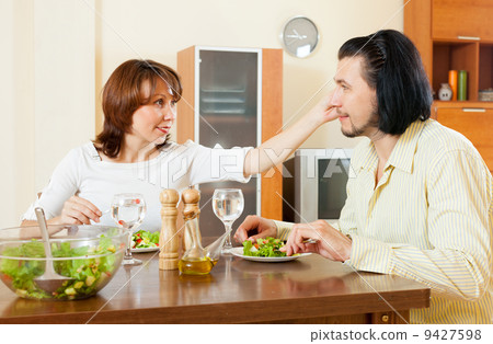 eating a delicious salad of vegetables in the house eating a delicious salad of vegetables in the house 9427598