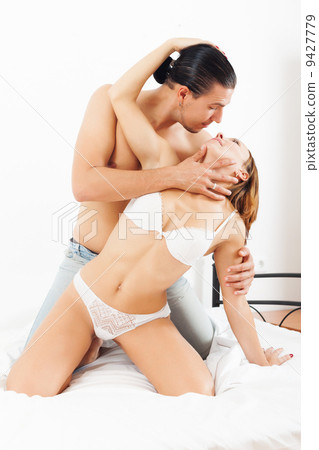 Couple playing in bedroom Couple playing in bedroom 9427779
