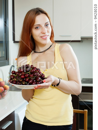 girl holding plate with cherries girl holding plate with cherries 9428010