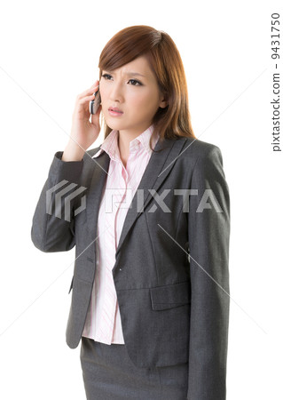 Angry businesswoman talk on phone 9431750
