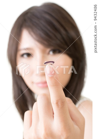 Young asian woman with lens in her hand Young asian woman with lens in her hand 9432486