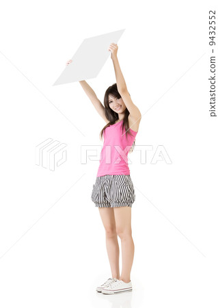 Young pretty woman holding a blank Young pretty woman holding a blank 9432552