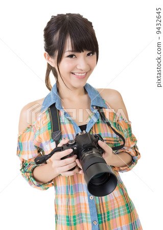 Beautiful smiling asian woman with photo camera 9432645