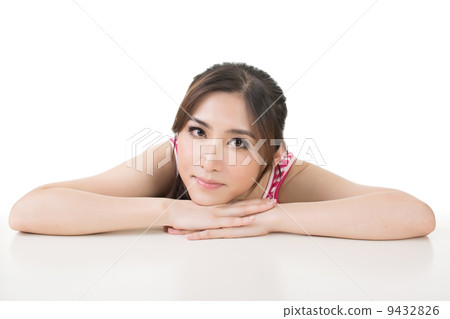 Pretty young asian girl sits on the table Pretty young asian girl sits on the table 9432826