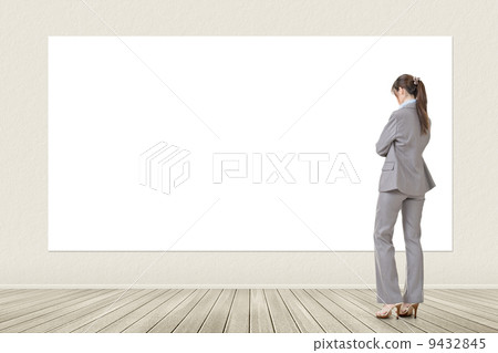 Asian business woman looking at blank banner Asian business woman looking at blank banner 9432845