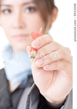 Asian businesswoman with dart in hand Asian businesswoman with dart in hand 9432846