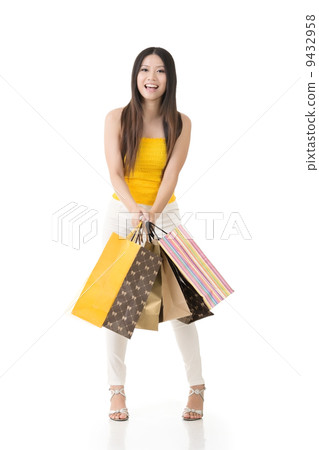 Attractive asian woman holding shopping bags Attractive asian woman holding shopping bags 9432958