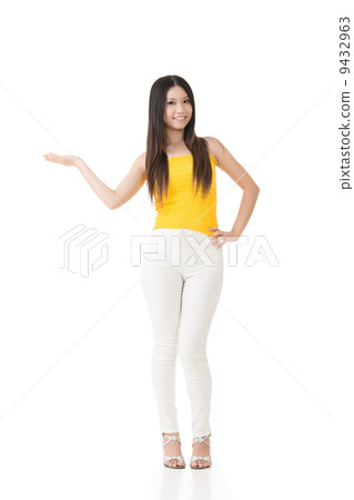 Attractive asian woman showing or introducing something 9432963