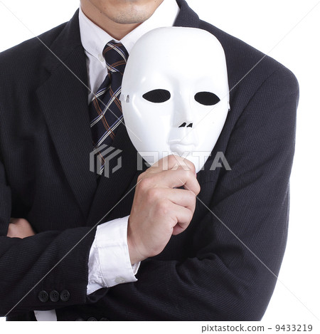 Businesman holding white mask Businesman holding white mask 9433219