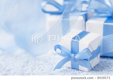 Boxes with gifts on a blue background Boxes with gifts on a blue background 9439571
