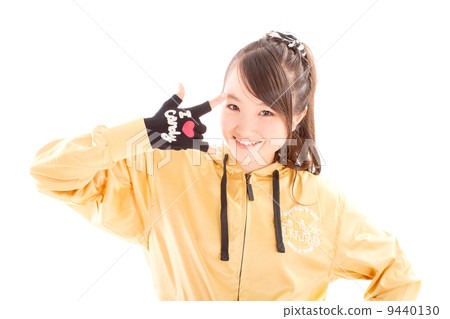 A pretty cheerful girl who dances hip-hop dance 9440130