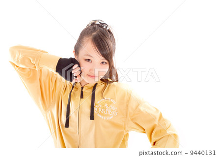 A pretty cheerful girl who dances hip-hop dance 9440131