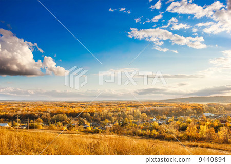 Russian landscape autumn hills and village below clouds, Russia Russian landscape autumn hills and village below clouds, Russia 9440894