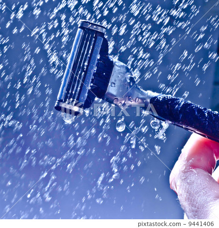 razor on a blue background and the splash of water 9441406