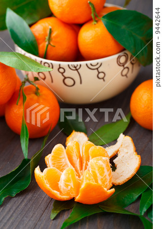 Tangerines on wooden background 9442644