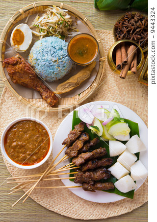 Nasi kerabu or nasi ulam, popular Malay rice dish. Blue color of Nasi kerabu or nasi ulam, popular Malay rice dish. Blue color of 9443324
