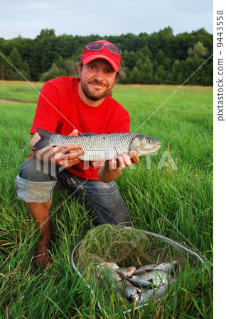 Fisherman and fish 9443558