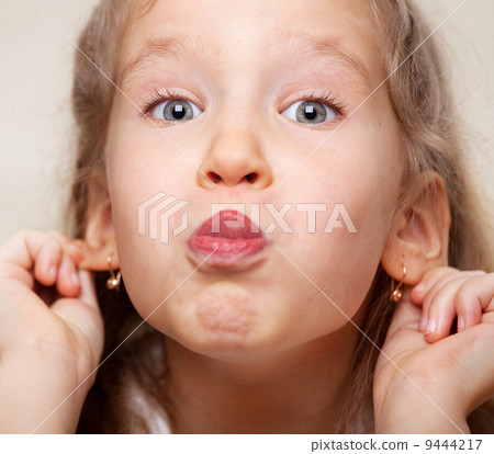 Grimacing child Grimacing child 9444217