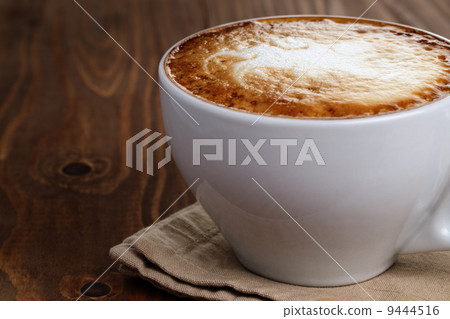 freshly made cup of cappuccino with abstract latte art freshly made cup of cappuccino with abstract latte art 9444516