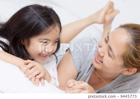 Portrait of happy Asian child and mother 9445773