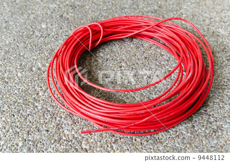 Red hot power cable on sand floor 9448112