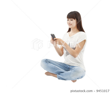 young woman using smart phone for messaging 9451017