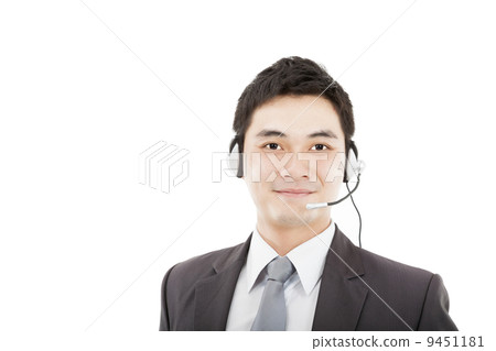 handsome businessman wearing headset and smiling isolated on whi handsome businessman wearing headset and smiling isolated on whi 9451181