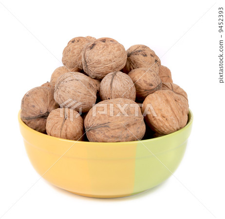 Bowl full with walnuts. 9452393