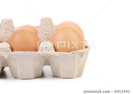 Brown eggs in egg box. 9452493