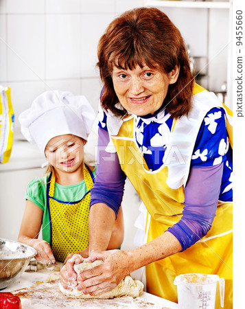 Grandmother and grandchild baking cookies. Grandmother and grandchild baking cookies. 9455660
