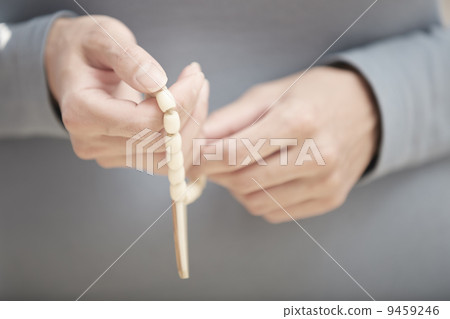 Hands with rosary beads 9459246