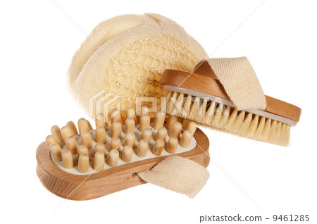 Bast and massage brush, it is isolated on white 9461285